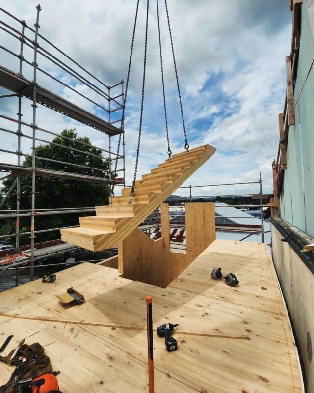 The perpendicular layers of solid wood make for a strong and beautiful set of stairs